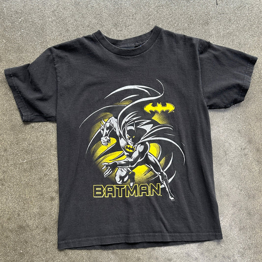 Black t-shirt with Batman graphic on a gray surface